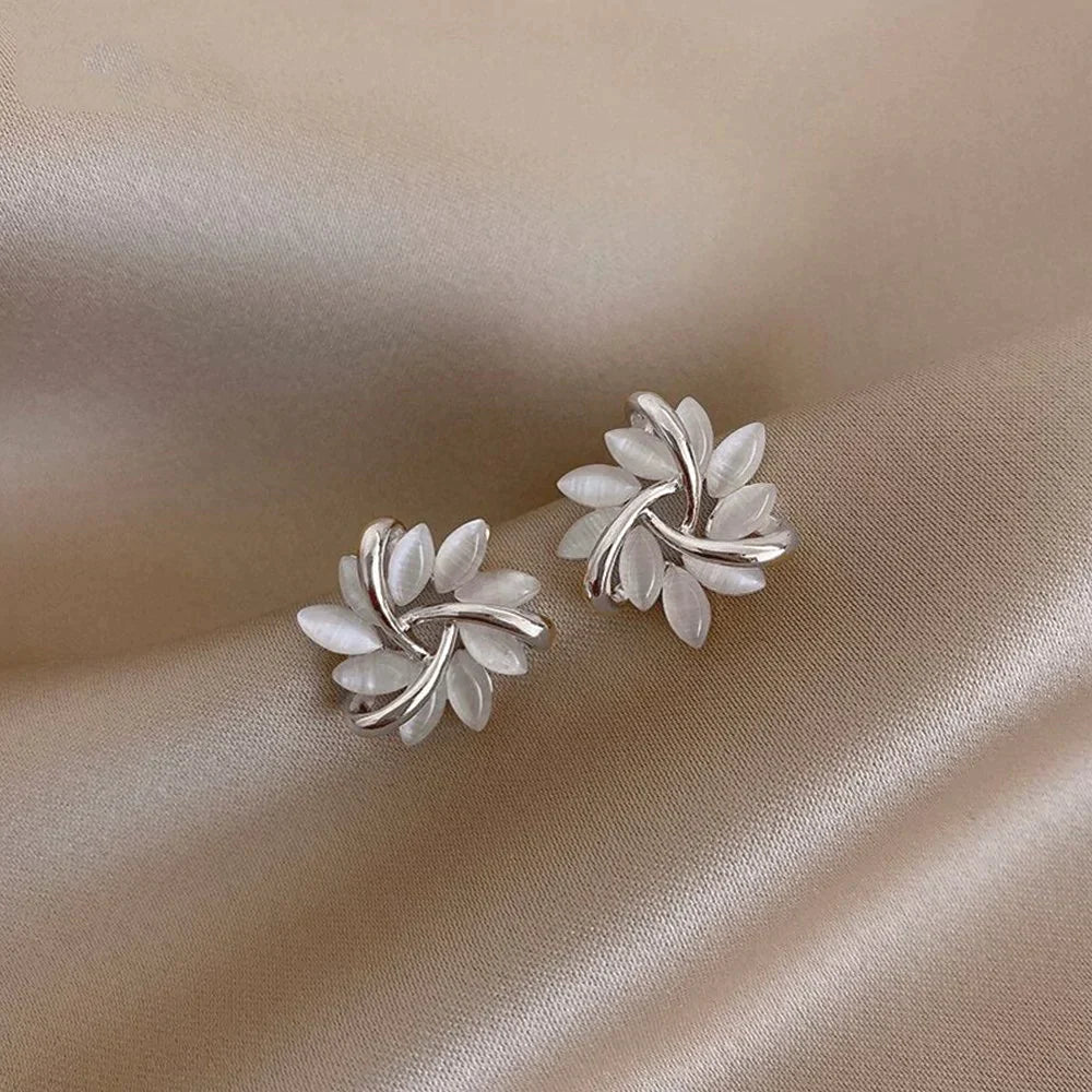 Gold circular earrings with opal leaves